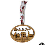 Santa's Sleigh Over Town Christmas Ornament