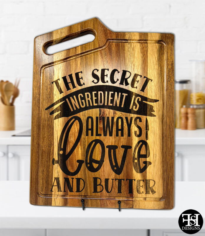 "The Secret Ingredient Is Always Love And Butter" Acacia Wood Cutting Board