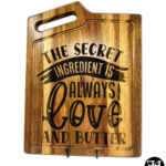 "The Secret Ingredient Is Always Love And Butter" Acacia Wood Cutting Board
